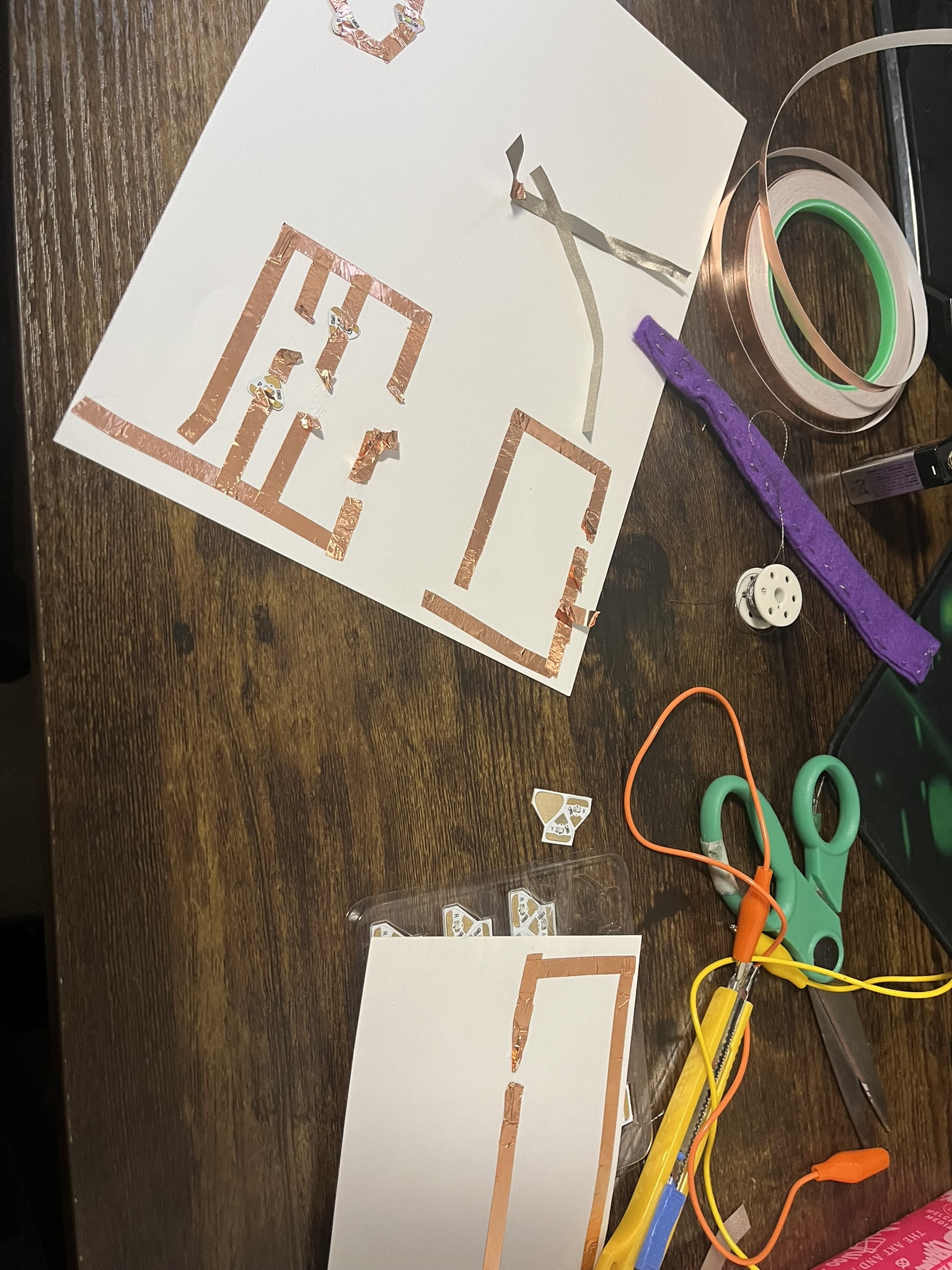 This photo shows the state of my work environment trying to get these circuits working with a variety of materials.