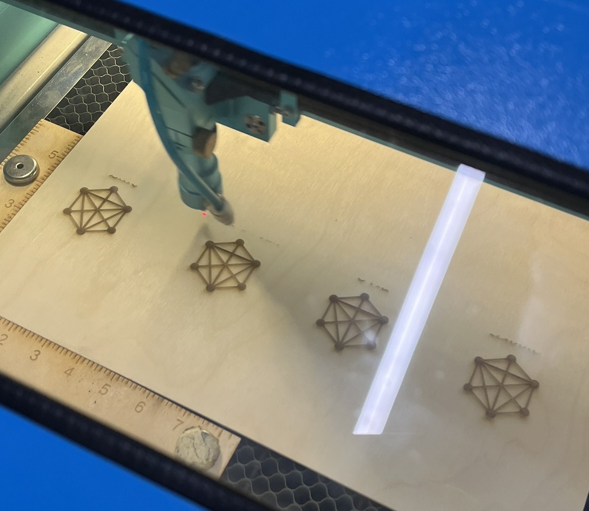 This photo was taken in one of the early stages of the laser cutting process, it was super fun to watch and see how quickly the laser works across a surface.